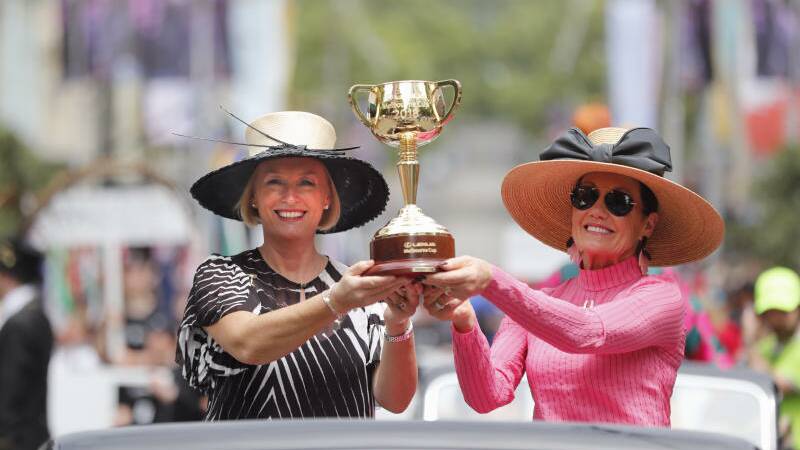 Lord Mayor Sally Capp and VRC Chairman Amanda Elliott with the Melbourne Cup. Photo: Jason South