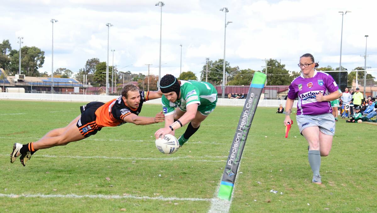 Caleb Cook goes aerial to score for Dubbo CYMS against Nyngan in Group 11 rugby league. Photo: Amy McIntyre, Daily Liberal