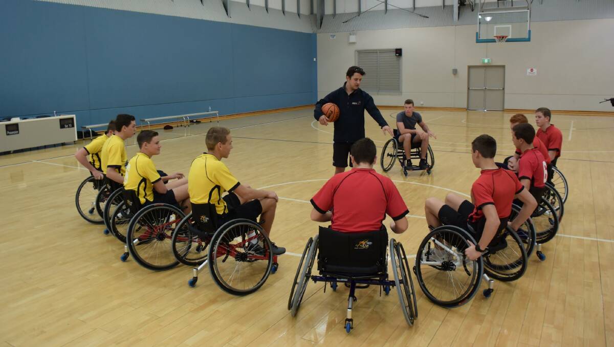 Wheelchair Sports NSW's Joe Shoebridge goes through the rules with the players.