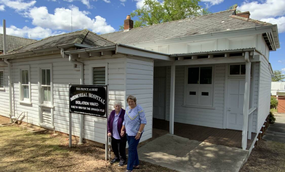 Ex-Tenterfield nurses and volunteers Lu Potter, left and Bev Chorley outside the Prince Albert Memorial Hospital isolation ward. Signage inside the cottage will be upgraded.