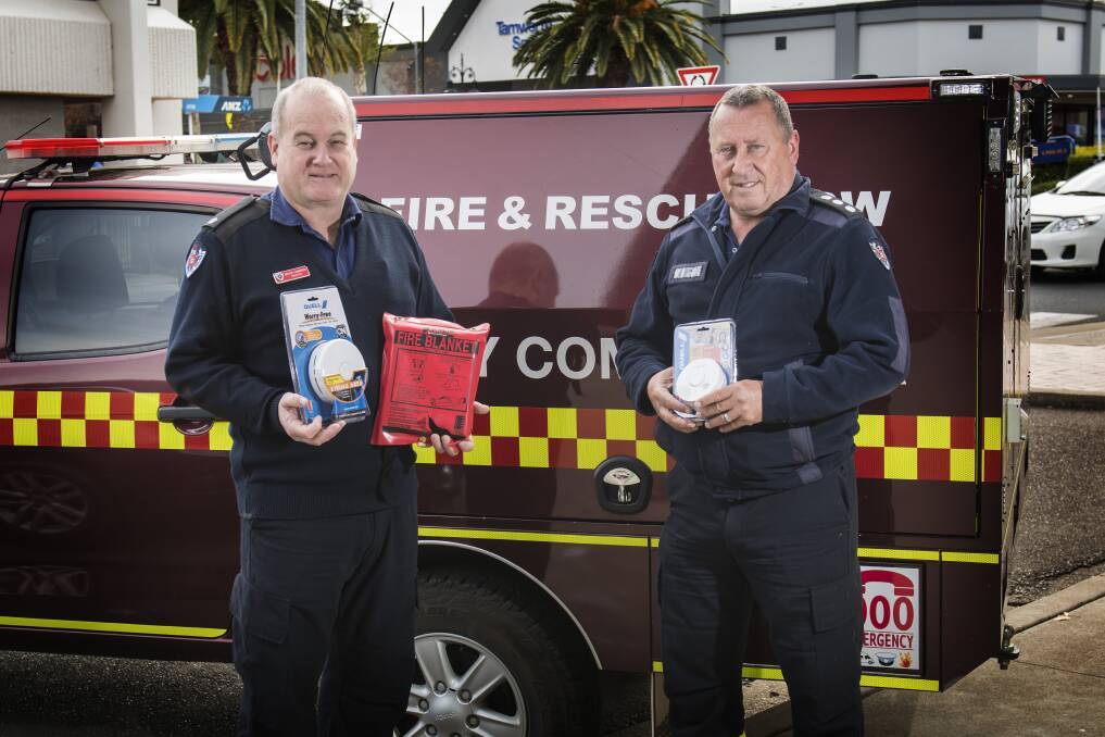 Leave it outside: Fire and Rescue NSW officers Bruce Cameron and Tom Cooper are warning people to keep barbecues outside, and everything else "a metre from the heater" as part of the winter fire safety campaign.