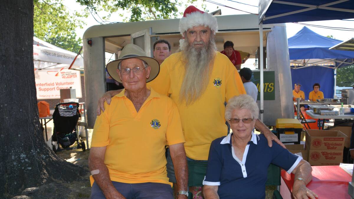 Wayne Lusty, when he was Lions president, at the 2017 Christmas Carnival with Keith and Annette Willcocks.
