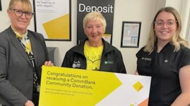 Lexie Sherren from Tenterlife Suicide Prevention Inc (centre) accepts the donation from Tenterfield Commonwealth Bank customer banking specialist Jacqueline Plaice and branch manager Holly Bourke.