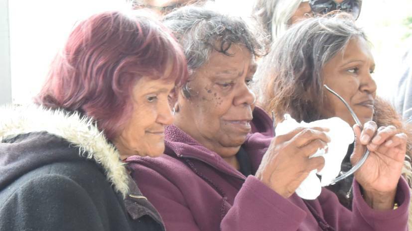 Clinton Duroux's mother June Speedy wipes away tears, flanked by Dianne Duroux and Dolly Jerome, at the unveiling of her son's memorial in Millbrook Park four years ago.
