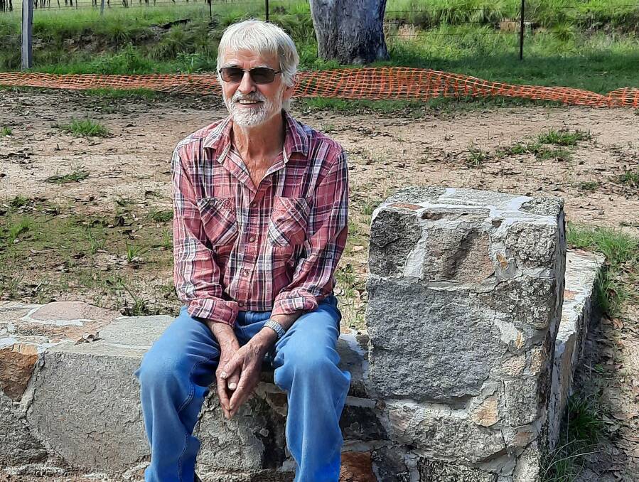 HANDIWORK: Dick Rochford with the new stone wall feature he constructed at Steinbrook Hall. Picture: Supplied
