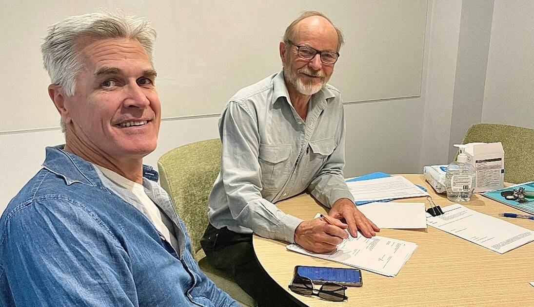 Rob Evans and Peter Jones from Friends of Tenterfield Aerodrome Association (FOTA)
sign a lease to manage the Tenterfield Airstrip. Picture supplied