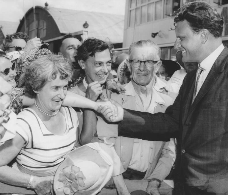 Dr Billy Graham, 1959: Dr Billy Graham arrives at Essendon Airport, Melbourne. As Dr Graham left the plane he was greeted with a deafening cheer, hats and handkerchiefs were waved and the crowd broke into song “Praise the Lord, ye people rejoice.”