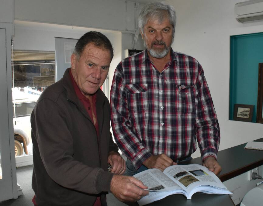 Tenterfield RSL Sub-branch president Dave Stewart and ANZAC Centenary Steering Committee chair Peter Reid go over final details of 'Some Time We’ll Understand'.