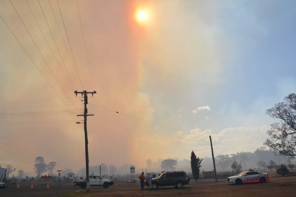 Roads on the western edge of town were closed on Tuesday afternoon after fire again threatened Tenterfield, fanned by hot westerly winds. Photo by Melinda Campbell.