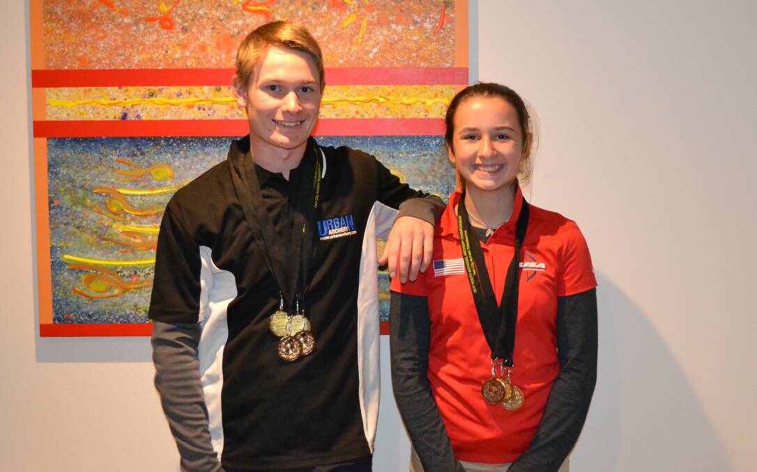Remy and Tabitha Leonard with medals won at the National Youth Archery Championships.