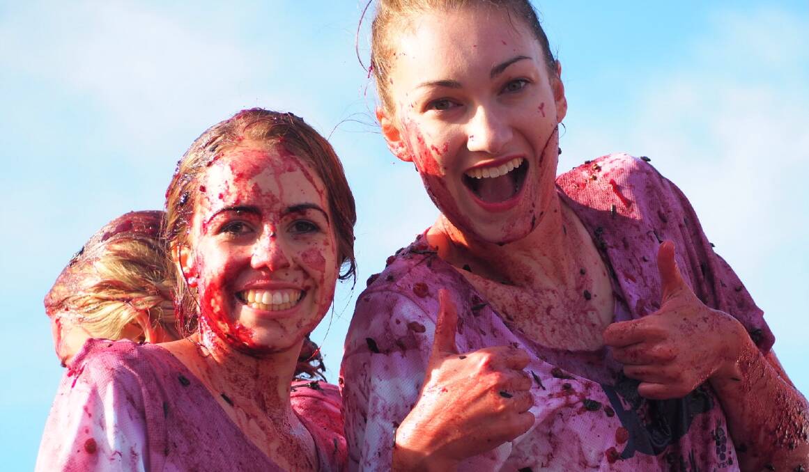 Apple and Grape Ambassadors Maddie Torrisi and Amanda McCosker were keen if stained participants in the last Grape Crushing Championships.