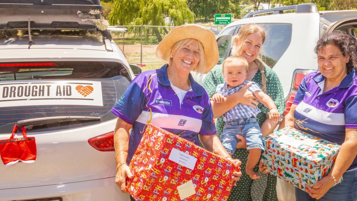 Coasties Diane Menzies and Paulette Marie of Gosford/Kariong Football Club with Candy Templeton and son Ty from Mingoola. Photo by Peter Reid.
