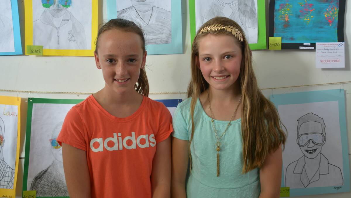 Annabel Roffey and Bridie Makejev check out the junior art entries.