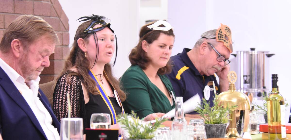 Skye Stapleton presided over the dinner meeting attended by district governor Terry Brown (on left). Melissa Blum and Harry Bolton were also at the head table.