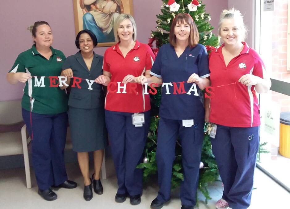 Tenterfield Hospital's Jasmine Springborg, Dr Siribaddana, Stacey Butler, Norma Rhodes and Kimberley Druitt are in the Christmas spirit.