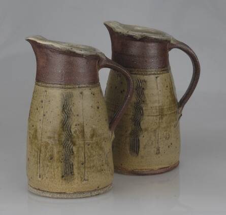 By contrast John James' pots exemplify functional, elegant shapes featuring subtle decorations
