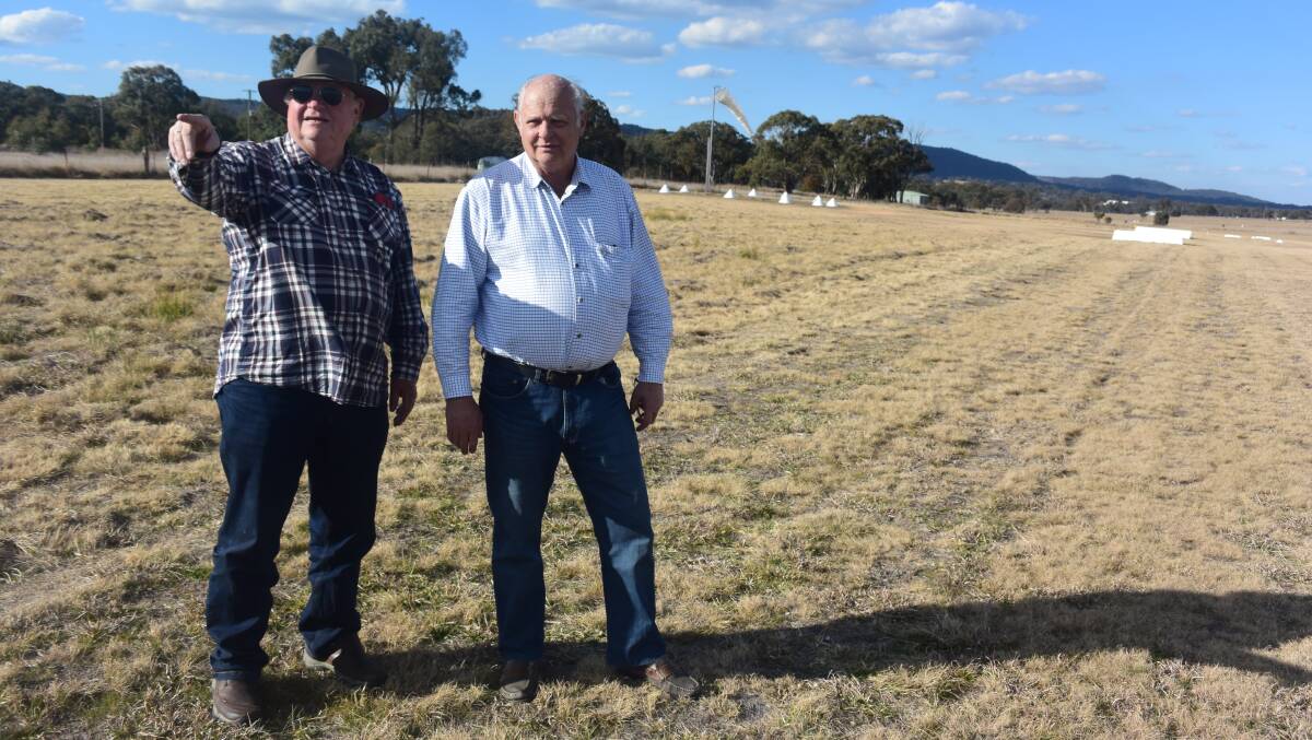 Pilots Brian Brown and Laurie West check out the state of the Tenterfield aerodrome as plans to upgrade it gather pace.