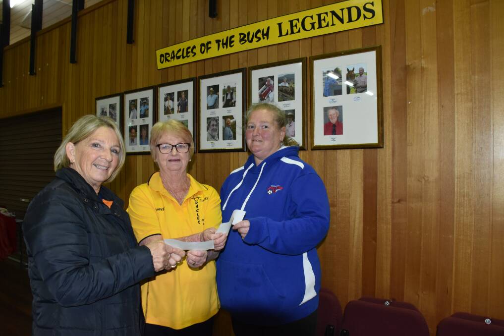Legendary: Oracles chair Carmel Rose flanked by donation recipients Marian Rogan (Tenterfield Traditional Archers) and Anne Newman (Tenterfield Thunder senior soccer).