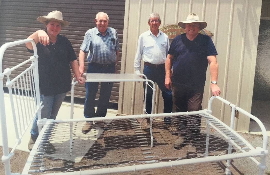 Restoration Group secretary Fiona Dodds with the Tenterfield Men's Shed's Rex Holley, group chair John Brown and new recruit Terry Dodds, with the restored furniture.
