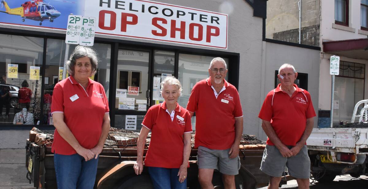 The helicopter support group has organised a fine load of firewood to raffle on the golf day. Pictured are Patricia Cahill, Susan McBeth, Max Whitford and Dodge Landers.