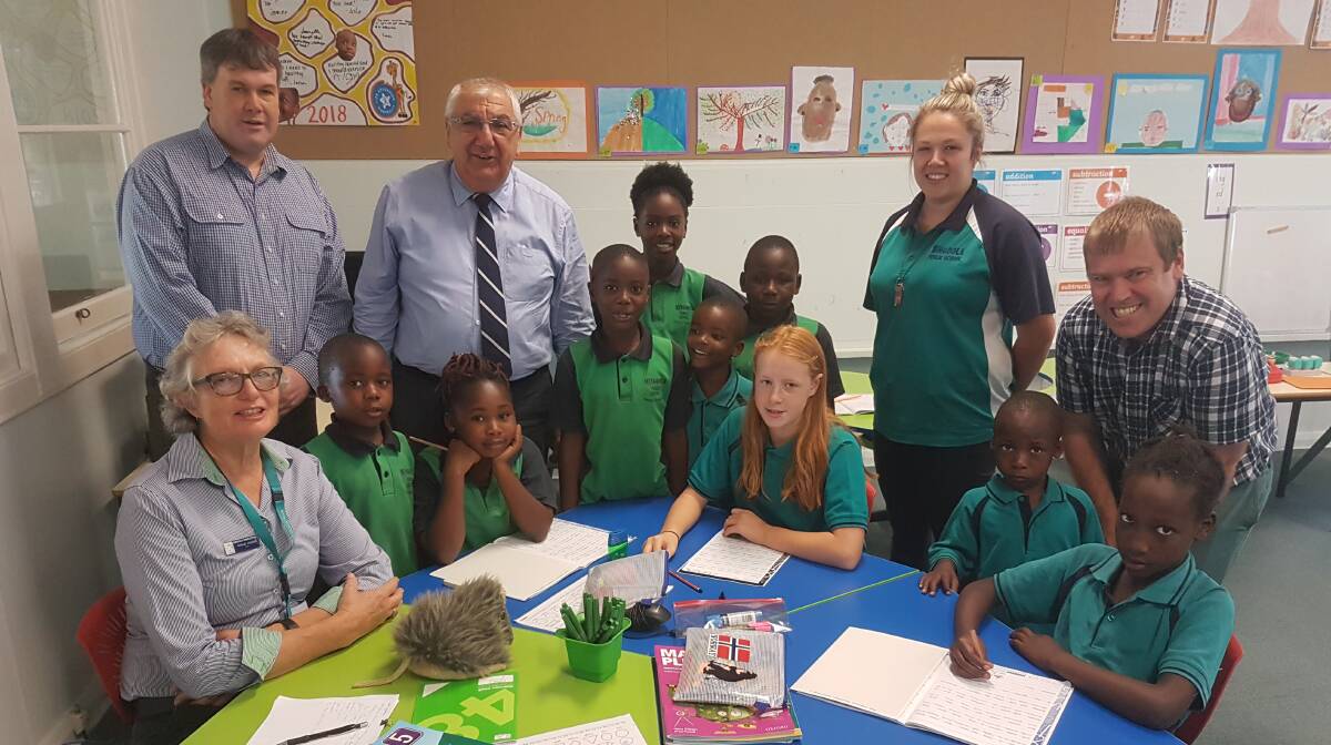 MP Thomas George with teachers and students at Mingoola Public School where air conditioning will be installed next year.