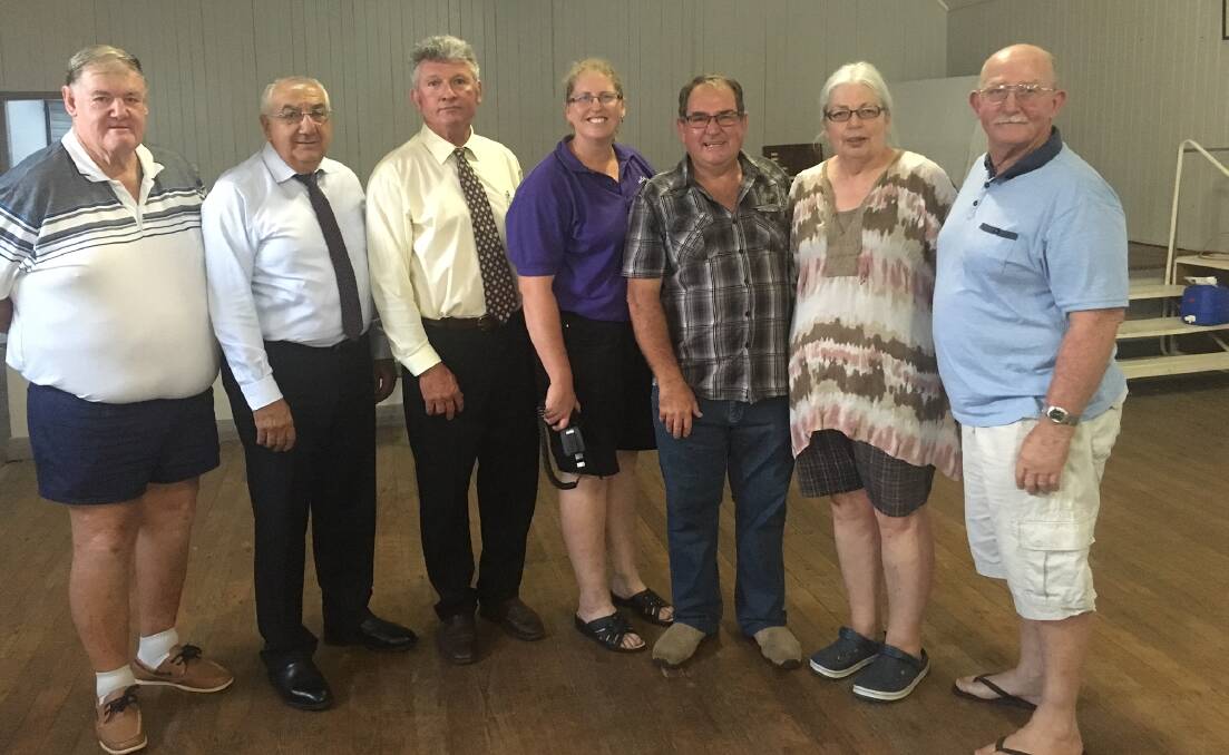 PLACE OF REFUGE: State member for Lismore Thomas George and Tenterfield mayor Peter Petty (second and third from left, respectively) with happy Urbenville community members Noel Vinall, Sally Quinn, Steve Goldthorpe, Kerry Brown and Joe O’Mullane for the announcement of the hall grant.
