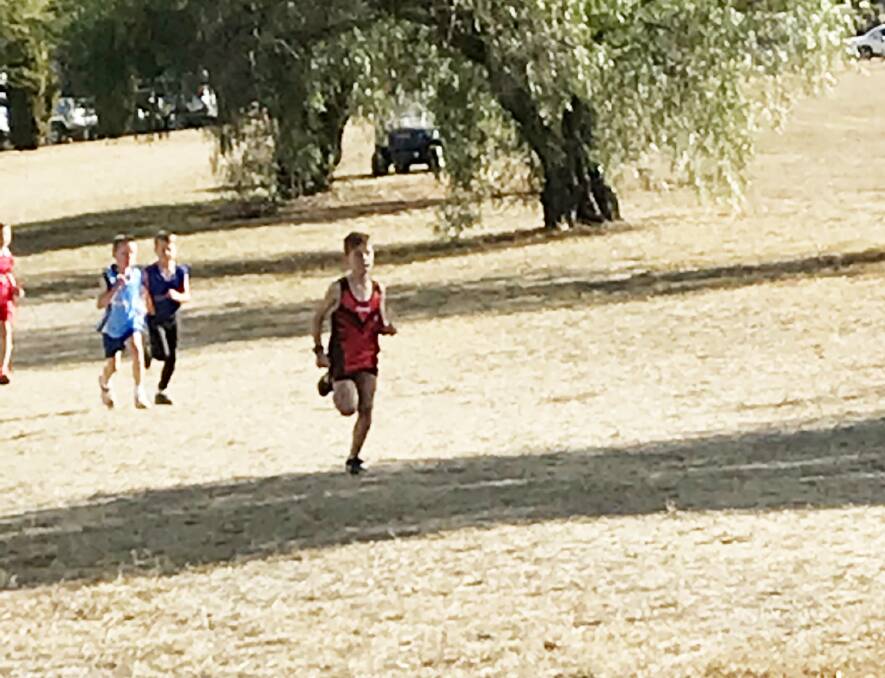 Cooper Kelly makes a break in the regional cross-country run in Cowra on Friday.