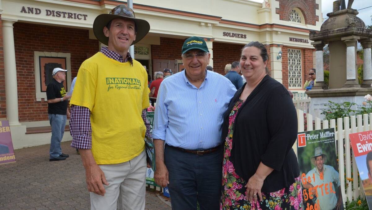 Con Hughes, state MP Thomas George and Kym-Maree Hennessy were on hand at Tenterfield Memeorial Hall to help Barnaby Joyce to victory.