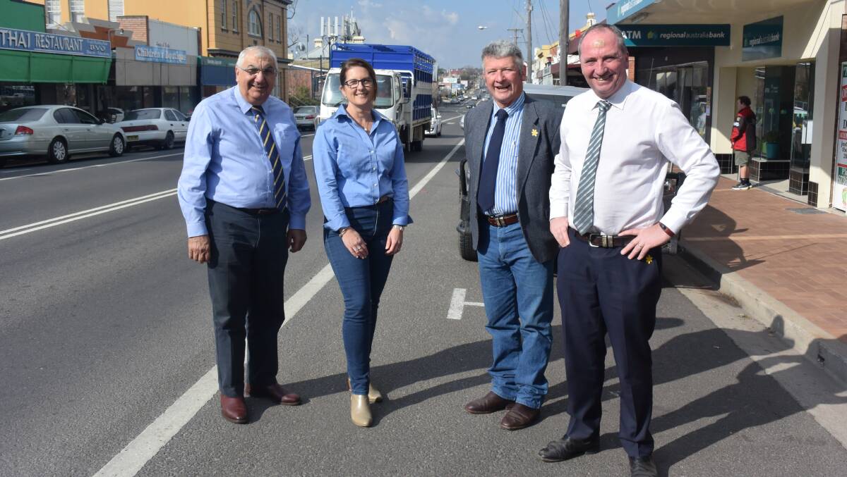 MP Thomas George, RMS Acting Director Northern Region Monica Sirol, Mayor Peter Petty and Deputy PM Barnaby Joyce in the main street in August discussing the heavy vehicle bypass.
