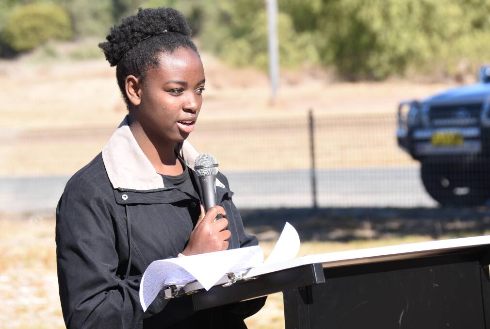 2018 NSW Youth Parliamentarian Ruth Uwikindu addresses the Refugee Week gathering at the Mingoola Public School.