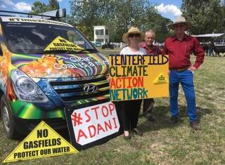 Dora Rochford, Martin O'Leary and David Townes flying the Tenterfield Climate Action Network flag at the recent Tenterfield Show.
