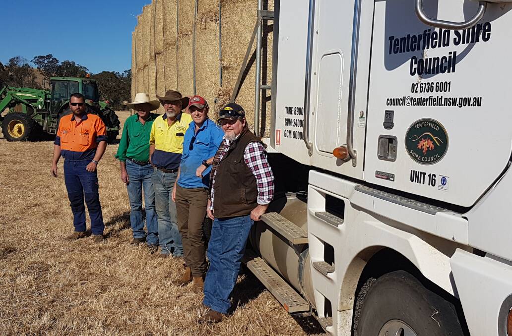 Tenterfield Shire Council's truck driver Karl Sherratt, Mallanganee property owner Bill Hewitson,  Daryl Boyd of Boyds Baling, Nationals candidate Austin Curtin and Bentley organiser Ray Payne as the first load of hay leaves Mallanganee for the Tenterfield Drought Appeal.