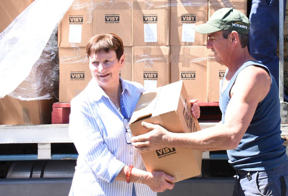 Tenterfield's CWA Evening Branch member Mary Hennessy was on hand to take delivery of the hampers at Tenterfield Showground.