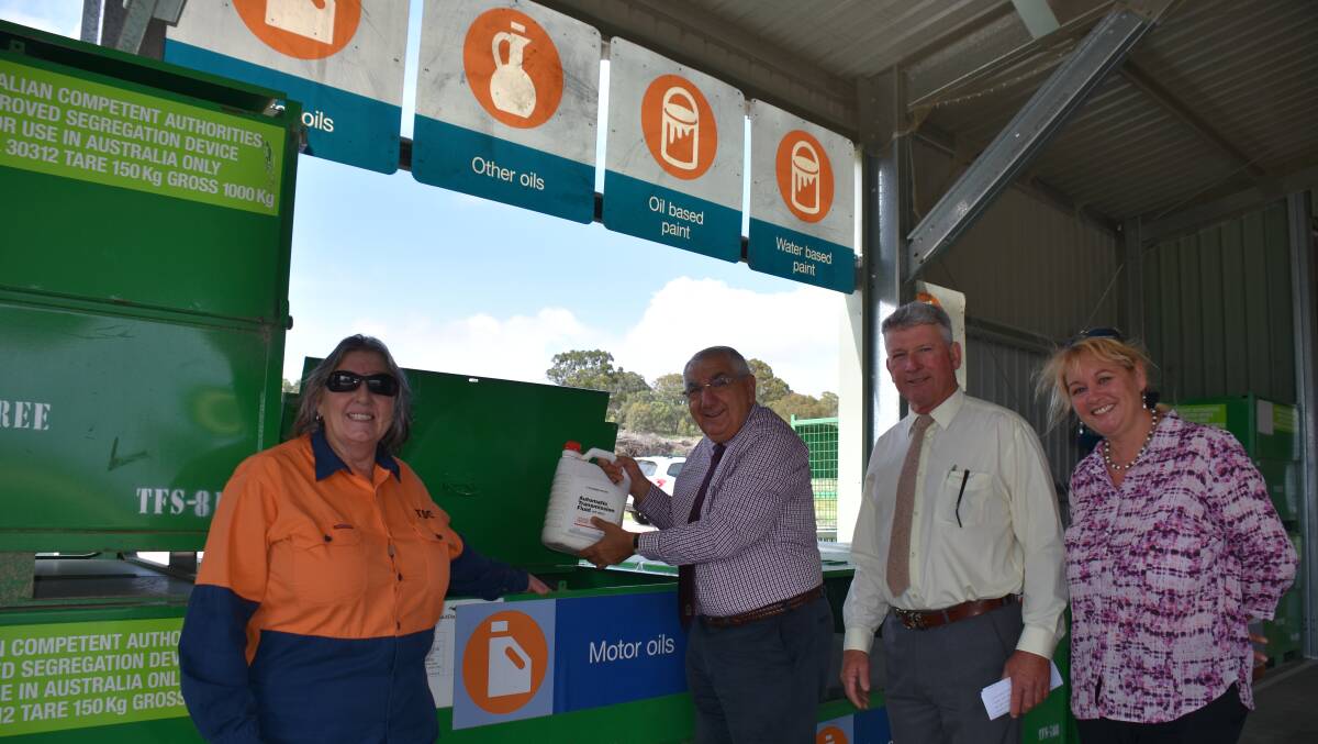 Waste Transfer Station manager Linda Plowman, mayor Peter Petty and water and manager Gillian Marchant with MP Thomas George as he tries out the new Community Recycling Centre.