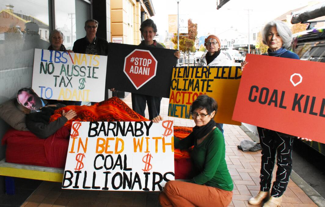 'Barnaby' is joined by Tenterfield Climate Action Network's Sue Eaton, David Townes, Constance Attard, Dora Rochford Meg McLeary and (in front) Gail Galloway to protest over-familiar ties with the Adani group.
