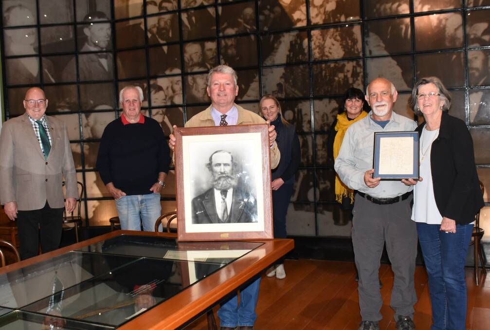 In fine company: Mayor Peter Petty (with a portrait of his 1871 counterpart Thomas Wellburn) and Peter and Linda Kerslake with the framed letter in the School of Arts Banquet Hall. They're accompanied by Greg Sauer, John Macnish, Tamai Davidson and Bronwyn Petrie, who spotted the find on Historic Australia.