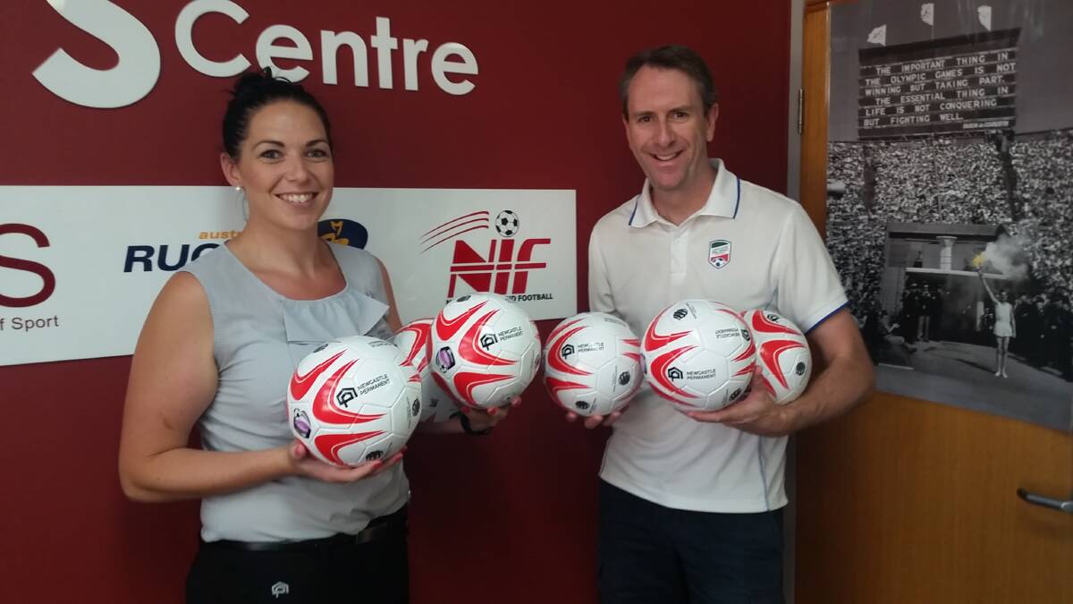 Northern Inland Football General Manager, Gavin Flanagan, and Newcastle Permanent Assistant Branch Manager for Tamworth, Jesse Brown, pictured with some of the balls that are ready for distribution.