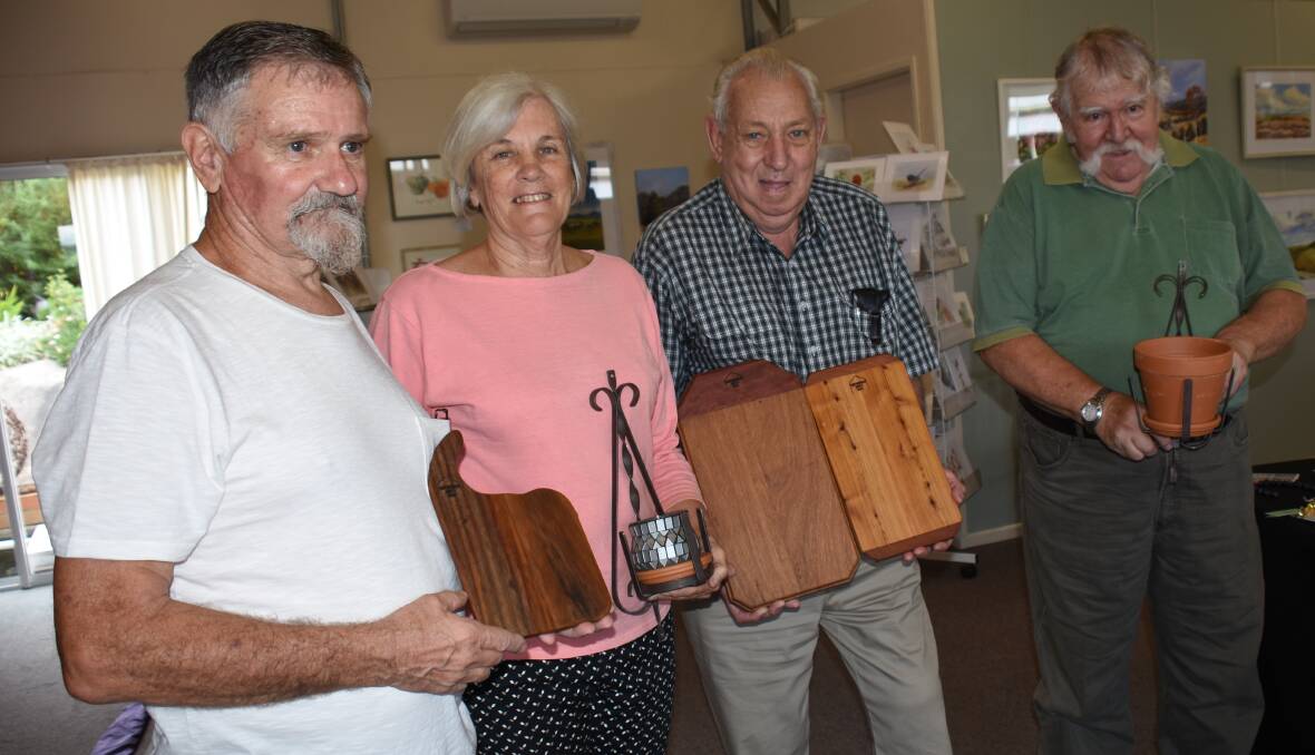 Edi Vah, Ruth O'Connell, Rex Holley and Ian Docherty with a selection of items that will be exhibited.