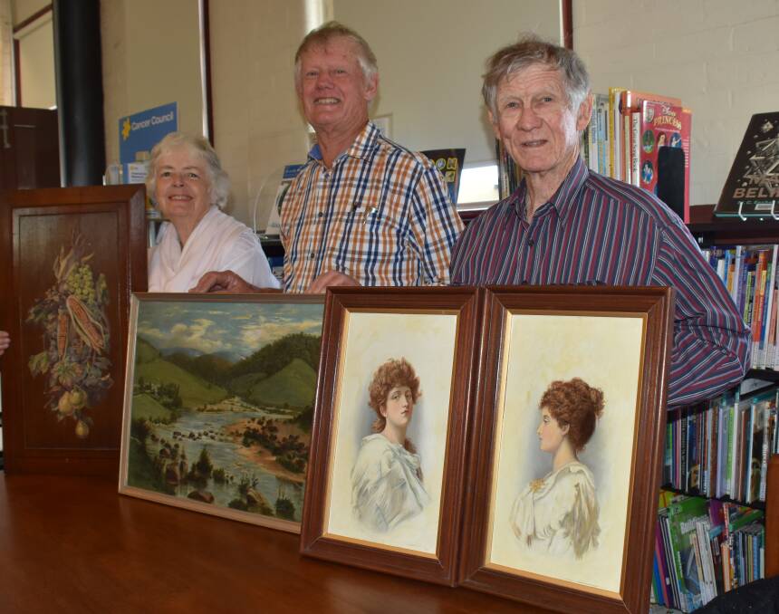 It was a pop-up art show at Tenterfield Library when Peter Jeffery, flanked by Dorothy and Ray Barraclough, compared their Tom Roberts-inspired art treasures.