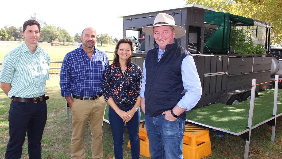 Peel High School agriculture teacher Ben Bowman with iFarm designers Steve Mansur and Kate Zlotkowski and Mr Joyce in Tamworth with one of the iFarm trailers.