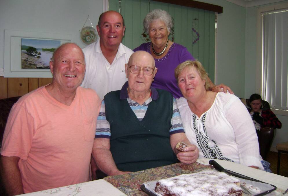 CENTRE OF ATTENTION: Kev Marsh celebrates his 90th birthday in Woodenbong, pictured with children Stephen, Terry and Wendy and wife Joyce.