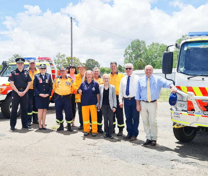 Steinbrook RFS members join with dignitaries to celebrate the brigade's new tanker.