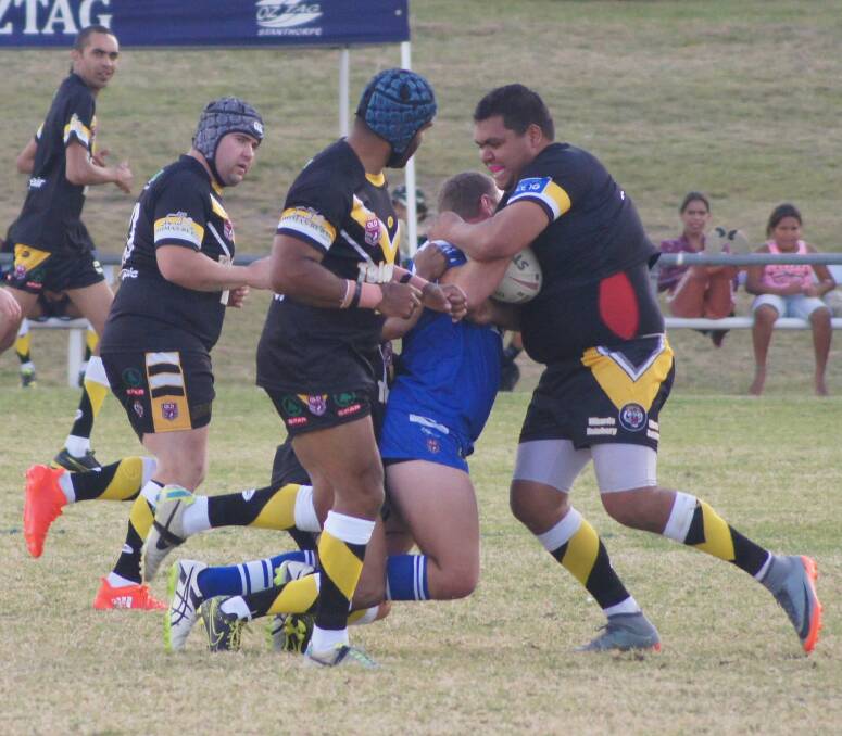 Adam McIntosh wraps up a Gremlin in the Tigers' match against Stanthorpe on Saturday, with Jake Adam and Geoff Swan in support. (Photo courtesy of the Stanthorpe Border Post.)
