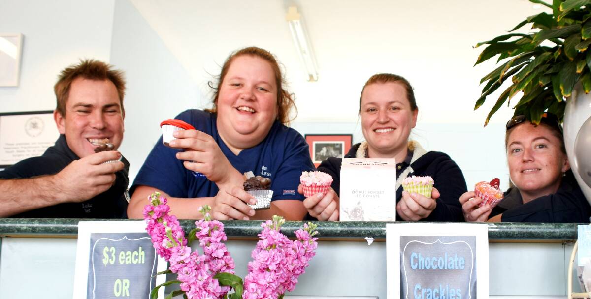 Luke Annetts, Bella Hamilton, Kate Wilson and Ashley Johnston with their favourites from the delicious display of home-baked treats.