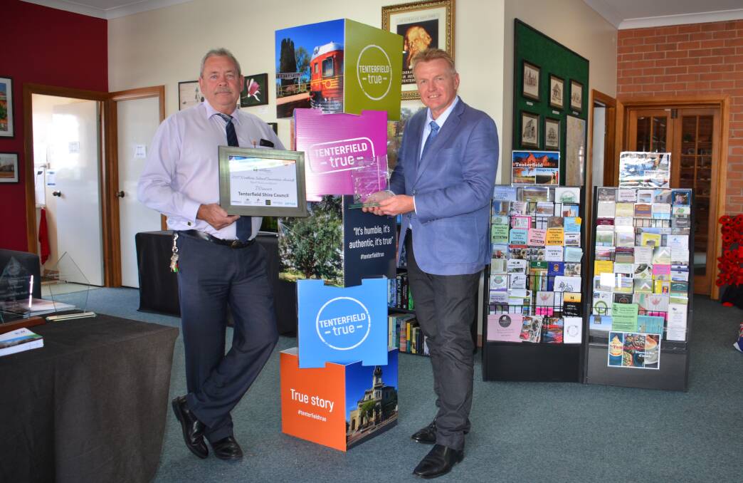 TENTERFIELD TRUE: Tenterfield Shire Council's business services officer Harry Bolton and chief executive officer Terry Dodds with the spoils of winning RDANI's Innovation Award for council's Tenterfield True branding.