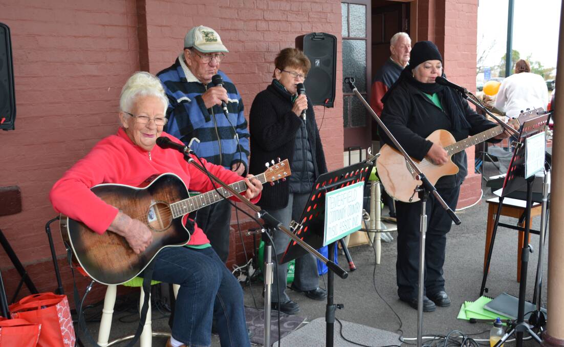 The gang performing at one of their favourite haunts, the Wallangarra Railway Markets.