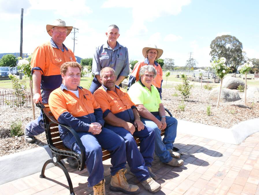 Parks & Garden staff deserve to take a load off after their work on the site. Standing are Brad Halliday, Mark Cooper and Gina Mann, and seated are Dylan Conner, Ernie Stratford and David Kelly.