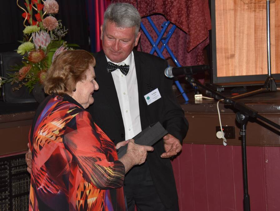 Mayor Peter Petty presents a surprised Maree Parker with her Special Recognition Award at Thursday night's Tenterfield Business & Tourism Excellence Awards.