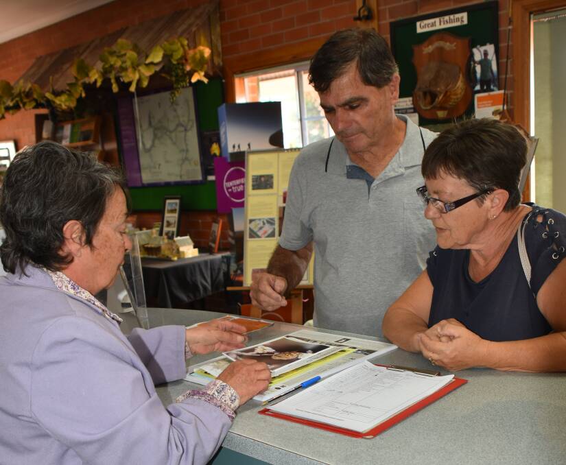 Tenterfield Visitor Information Centre volunteer Deb Adam advises visitors Hans and Sonia Boonstoppel of Hervey Bay on what the shire has to offer them during their stay.