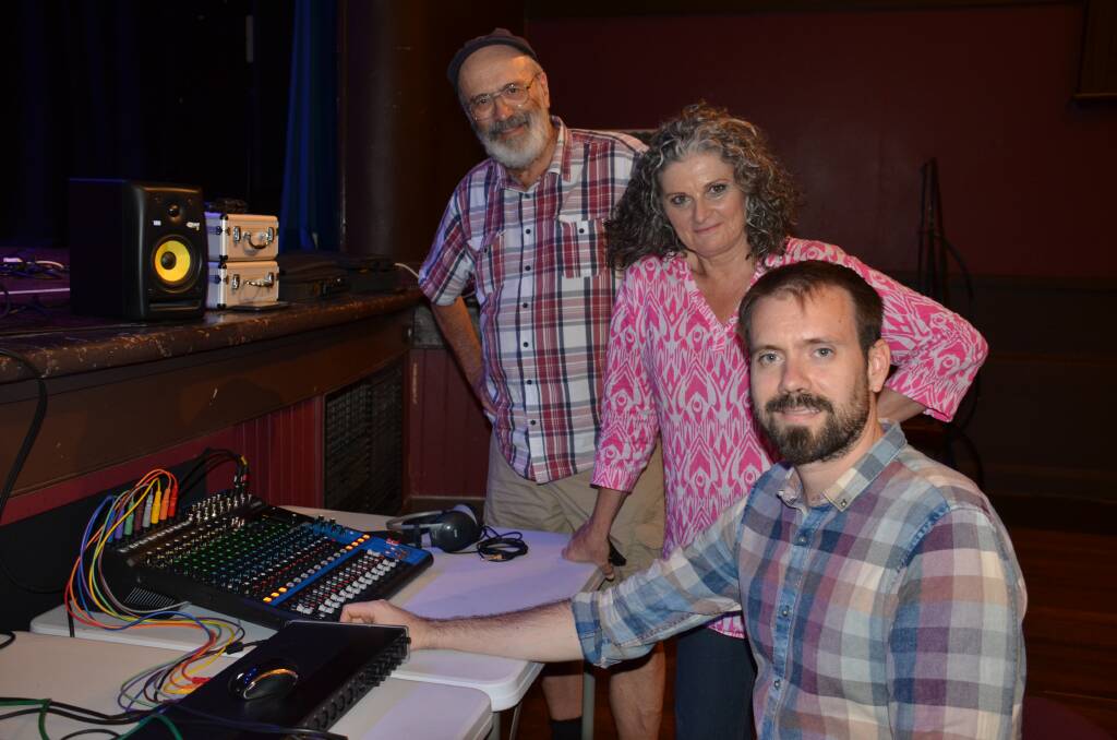 Singer Christine Davis listens to her playback after a professional recording session at Tenterfield Cinema with father-and-son team Peter and Jono Harris.